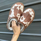Cow print bruin slippers