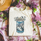 Mountain blue beer can w/ flower design