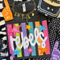 REBELS NEON RAINBOW STARS TEE
