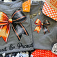 LOUD & PROUD ORANGE BOW TEE