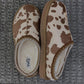 Cow print bruin slippers